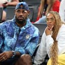 Is LeBron James retiring, who’s his wife Savannah, do they have kids, what’s his net worth?  LeBron James of Team United States and wife, Savannah James, look on during a Women's basketball quarterfinal game between Team United States and Team Nigeria on day twelve of the Olympic Games Paris 2024 at Bercy Arena on August 07, 2024 in Paris, France. (Photo by Pascal Le Segretain/Getty Images)