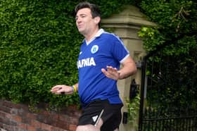 Mayor of Greater Manchester Andy Burnham outside his house in Warrington, Cheshire