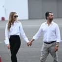 Donald Trump Jr. wedding to Bettina Anderson: When was he engaged to Kimberly Guilfoyle? Donald Trump Jr. and Bettina Anderson walk on the tarmac as they await the arrival of President Donald Trump and First Lady Melania Trump at Teterboro Airport in Teterboro, New Jersey, from where they will motorcade to attend the 2025 FIFA Club World Cup final football match between England's Chelsea and France's Paris Saint-Germain at MetLife Stadium in East Rutherford, New Jersey, on July 13, 2025.  Photo by BRENDAN SMIALOWSKI/AFP via Getty Images    