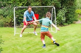 The foldable football goal includes a sturdy metal frame and provides plenty of space for family kickabouts and football practice in the garden.