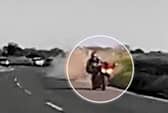 The shocking moment a motorcyclist was thrown from his bike into the road - narrowly avoiding oncoming traffic