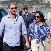 Prince Harry, Meghan and Archie photo: What has she said in new family post, did she send King Charles a gift? : Prince Harry, Duke of Sussex and Meghan, Duchess of Sussex arrive to meet volunteer first responders from Bondi Surf Bathers' Life Saving Club, during a visit to Bondi Beach, on day four of the royal trip to Australia on April 17, 2026 in Sydney, Australia. Volunteers from the organisation, founded in 1907, played an integral role in protecting beachgoers and saving lives during the terrorist attack at Bondi Beach on December 14. (Photo by Jonathan Brady-Pool/Getty Images)