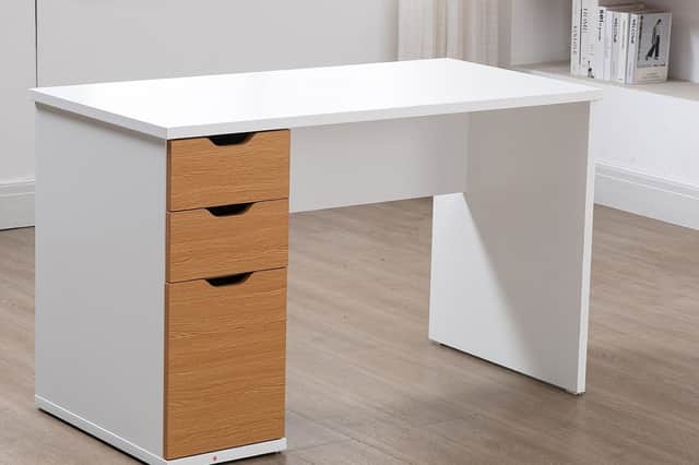 Two smooth-gliding drawers and a spacious cupboard provide plenty of room to keep home office essentials neatly tucked away