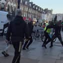 Video footage shows the moment a gang of suspected shoplifters viciously beat up a Lidl security guard and shop worker
