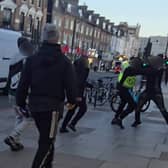 Video footage shows the moment a gang of suspected shoplifters viciously beat up a Lidl security guard and shop worker