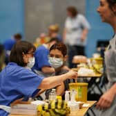 A student receiving an injection in the sports hall at the University of Kent in Canterbury after an outbreak of meningitis on the campus