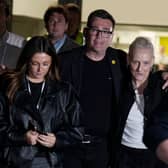 Labour party MP Andy Burnham leaves The Edge in Wigan with his wife Marie-France Van Heel (right) and their daughter Rosie after winning the Makerfield by-election