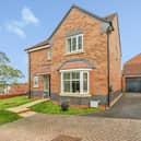 The four-bedroom detached home on Dove Close in Shrewsbury includes a garage, EV charger and private rear garden.