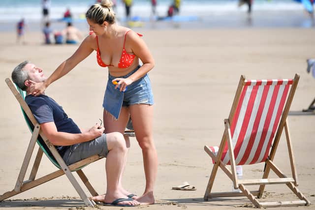 Sunscreen being applied