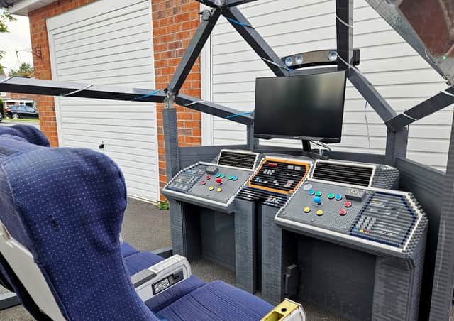 The life-size cockpit, which James hopes will fetch £1,000 at auction.