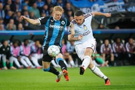 Aston Villa's John McGinn fights for the ball with Club Brugge's Joaquin Seys in the Champions League