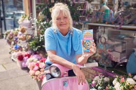 Kate Daven-Thomas  celebrates winning £300,000 on a National Lottery Cashword Extra Scratchcard