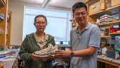 Simiao Niu, an assistant professor of biomedical engineering in the Rutgers School of Engineering (right), and doctoral student Fuying Dong work in the lab on a smart shoe powered by the wearer's footsteps