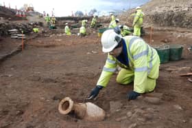 Cura Terrae archaeologist digging up an amphora at Cataractonium.