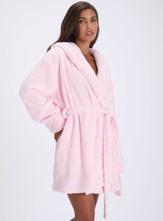 Boux Avenue's Heart fluffy short dressing gown features a pretty pink colour, an embossed heart pattern and a cosy hood, making it a tempting pick for chilly evenings at home.