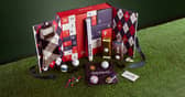 The American Golf Luxury Advent Calendar features 24 days of golfing treats, including balls, tees, accessories and more, all presented in festive red, white and blue packaging.