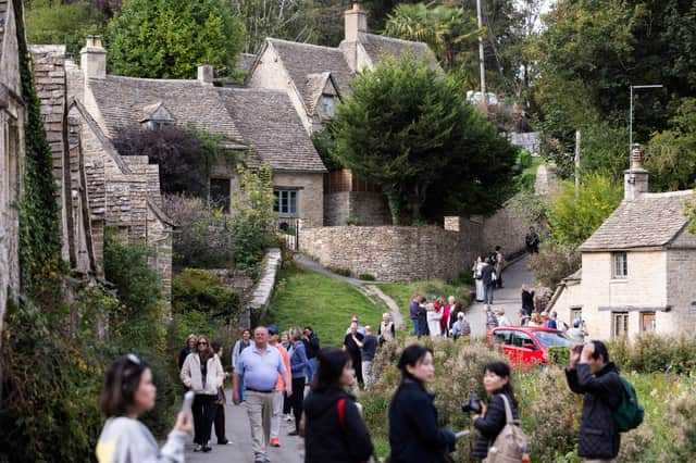 Bibury in the Cotswolds attracts huge crowds, with visitor numbers reportedly reaching 20,000 a day during peak periods.