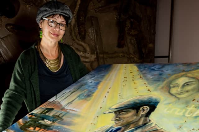 Artist Sinéad Smyth pictured with the new painting on display at the Tower Museum.