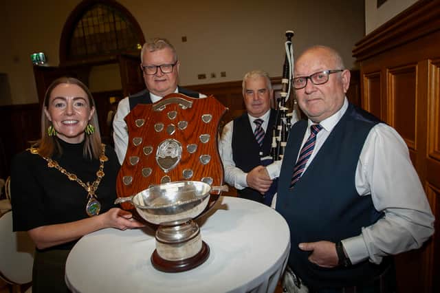 The Mayor, Grace Ui Niallais, pictured with Bready Ulster Scots Pipe Band members, Gary McDonald, Bertie Campbell and Stephen McGuinness, during the reception in the Guildhall.