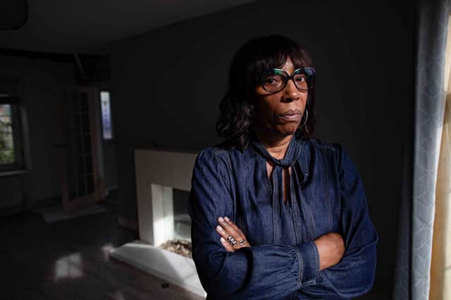 Collette McFarlane inspects her rental property, which she says was trashed by tenants.