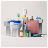 The Lookfantastic 12 Days of K-Beauty Advent swaps traditional advent doors for a bag containing 12 numbered boxes of Korean skincare treats.