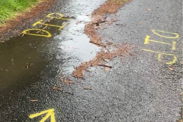 A dip on the Upper Cranlome Road which has been marked by the Roads Service
