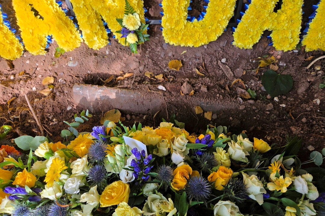 Daughter's horror after finding dad's coffin inches below ground days after funeral