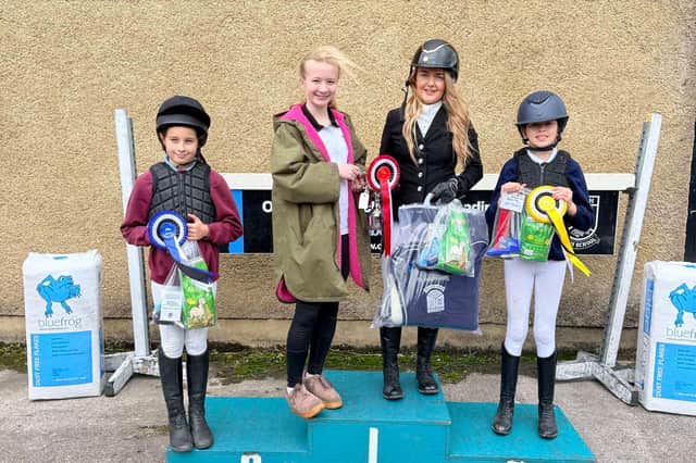 Connie McKelvey, Omagh High School pupil and Woodland Haulage representative, presenting presenting the new Woodland Haulage Perpetual Cup to Sophie Gurney. Also in the picture is second place, Myra McCarroll and third place, Farah Buchanan. SU0944CD26