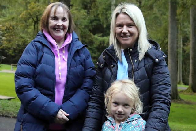 Margaret Hemphill, left, with Louise Smyth and daughter, Thea at the Gortin Glen Sponsored Walk. IB0542CD26