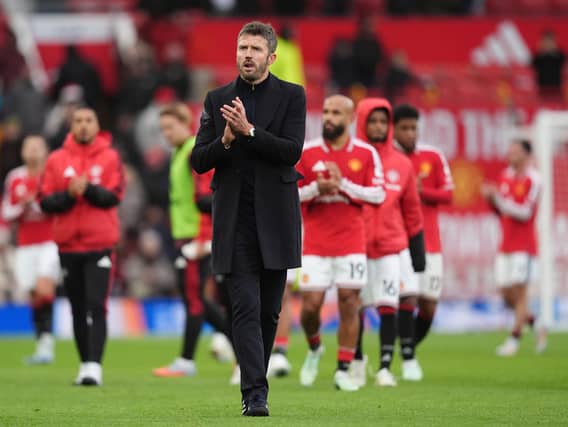 Michael Carrick applauds the fans after his side’s 3-0 home defeat to Bournemouth