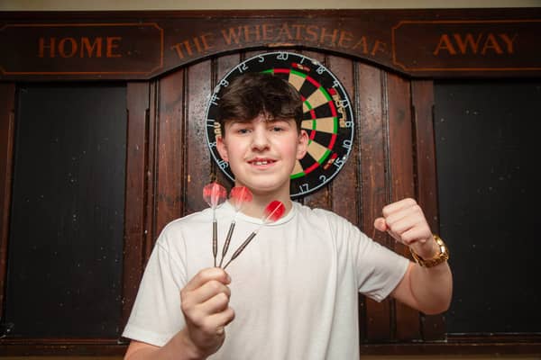 Makinley Cooper-Johnson, known as Mighty Mak, at home in Wrexham, the 14-year-old is set to go head-to-head against Luke Littler in a bid for a £500,000 prize. 