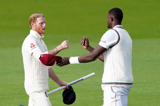 England's Ben Stokes (left) and West Indies' Jason Holder fist bump after the match at Old Trafford. Picture: Jon Super/NMC Pool/PA