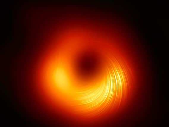 The M87 supermassive black hole in polarised light, photo courtesy of EHT Collaboration.