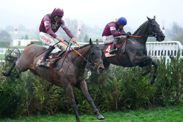 Delta Work ridden by Jack Kennedy (right) goes on to win The Glenfarclas Chase ahead of Tiger Roll ridden by Davy Russell who finished second during day two of the Cheltenham Festival at Cheltenham Racecourse.