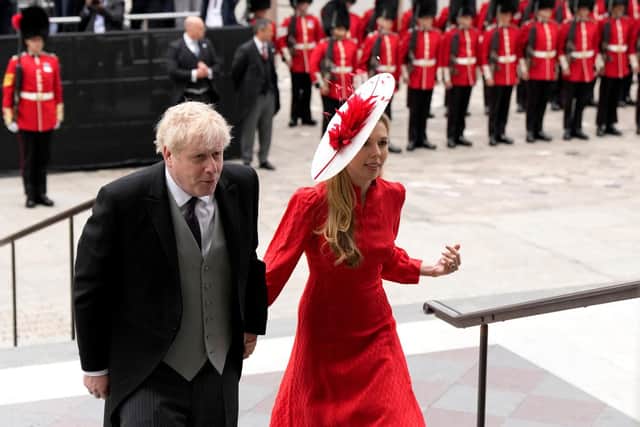 Prime Minister Boris Johnson and his wife Carrie Symonds arrive to attend the National Service of Thanksgiving for The Queen's reign at Saint Paul's Cathedral. The PM was met with a mixture of boos and cheers.