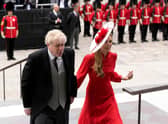 Boris Johnson and his wife Carrie arrive at the service, with a mixture of boos and cheers heard from the crowd. 