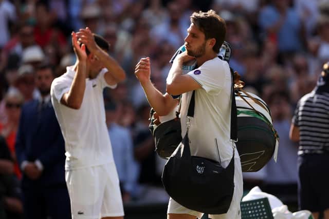 Novak Djokovic leads the applause for British No 1 Cameron Norrie after their men’s singles semi-final win at Wimbledon. Picture: Ryan Pierse/Getty Images
