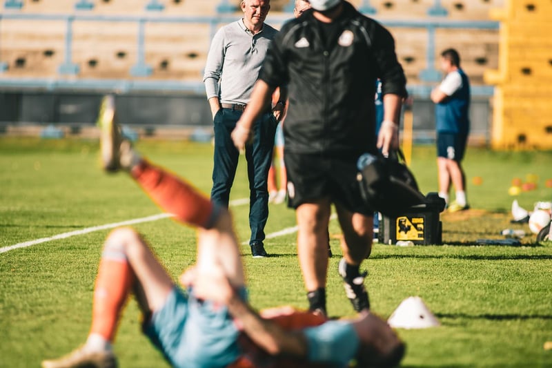 Town boss Pete Wild looks on nervously as striker Matty Stenson nurses an injury in pre-season. The forward went on to suffer another injury that kept him out for most of the season. Photo: Marcus Branston