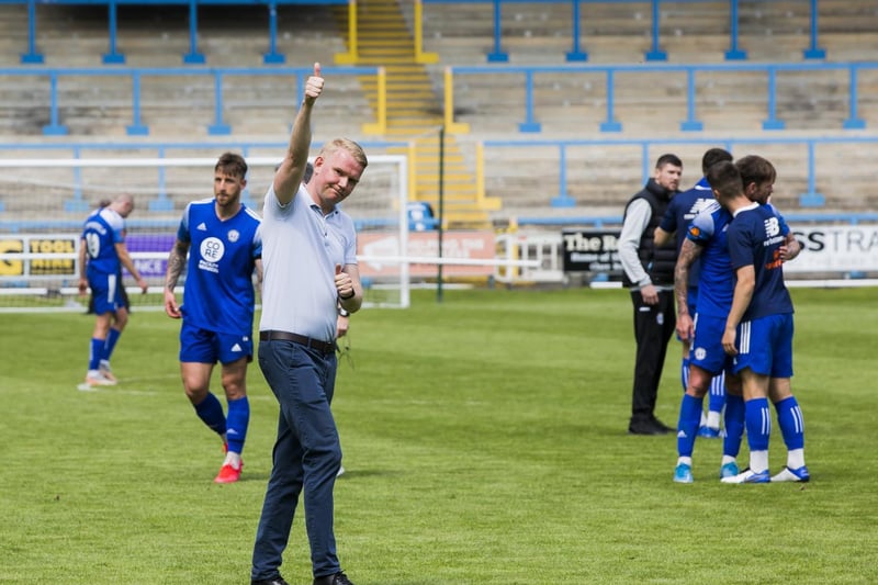 Town boss Pete Wild signals to the fans after the final game of the campaign saw Halifax miss out on the play-offs. Photo: Jim Fitton