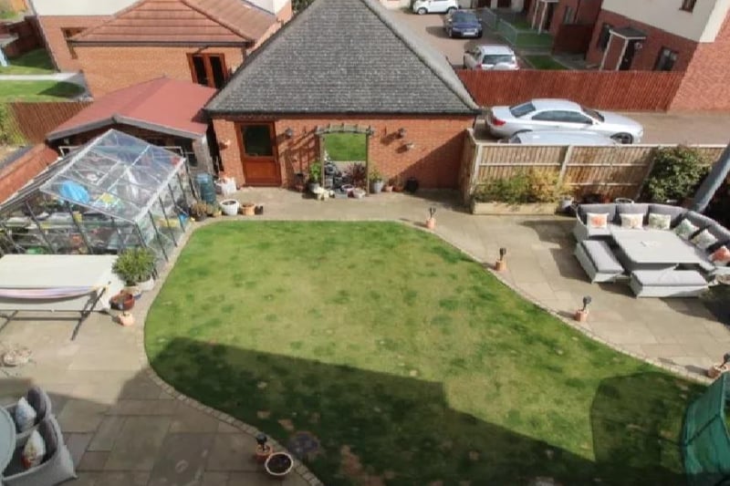 This overhead look at the rear garden highlights just how livable and ideal a place it would be to hang out over the summer. With lawn space for activities and outdoor furniture spots perfect for a BBQ.