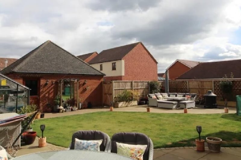 The whopping rear garden is laid to lawn with patio sitting areas and a enclosed wooden fence with a gate to the side and rear. It has a door to the double garage, ample power points and a water point.