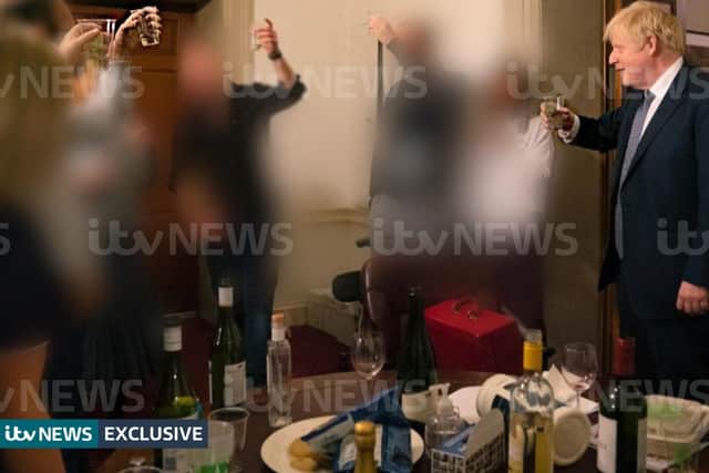 A photograph obtained by ITV News of the Prime Minister raising a glass at a leaving party on 13th November 2020. 