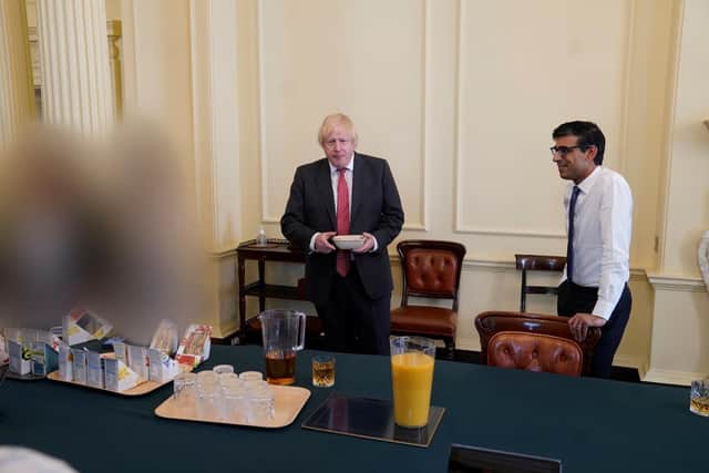 Prime Minister Boris Johnson (left) and Chancellor of the Exchequer Rishi Sunak at a gathering in the Cabinet Room in 10 Downing Street on his birthday