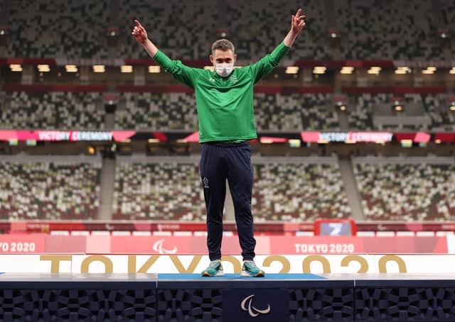 <p>Gold medalist Jason Smyth of Team Ireland celebrates on the podium of Men's 100m - T13 Final on day 5 of the Tokyo 2020 Paralympic Games at Olympic Stadium on August 29, 2021 in Tokyo, Japan.</p>