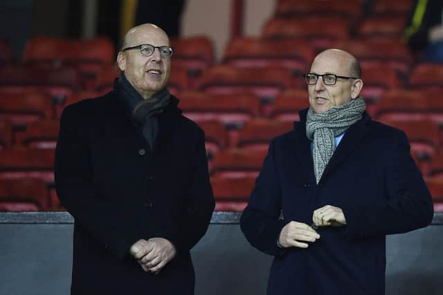 Avram Glazer (L) and Joel Glazer, the Co-Chairmen of Manchester United.