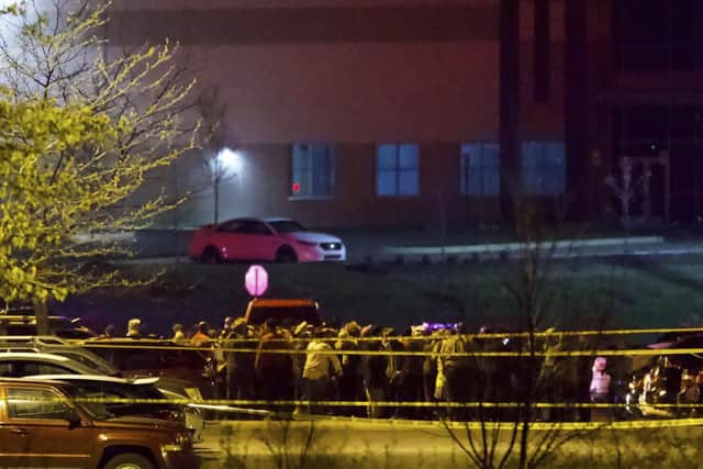 People stand outside a FedEx facility near Indianapolis International Airport after a shooting with multiple victims was reported late Thursday night (Photo: Mykal McEldowney/The Indianapolis Star via AP)