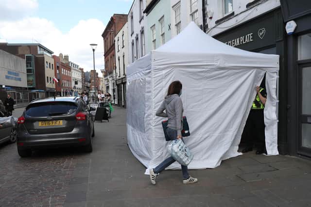A police tent outside The Clean Plate cafe in Southgate Street, Gloucester (Photo: David Davies/PA Wire/PA Images)