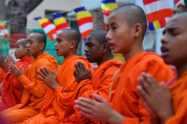 Buddhist monks offer prayers during "Guru Purnima" festival celebrations at the Maha Bodhi Society in Bangalore in 2019 (Picture: Getty Images)