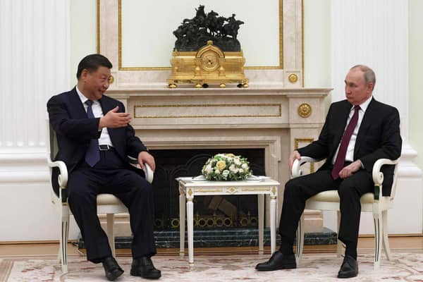 Russian President Vladimir Putin met with China's President Xi Jinping at the Kremlin in Moscow on Monday. (Picture: Sergei Karpuhkin/AFP via Getty Images)