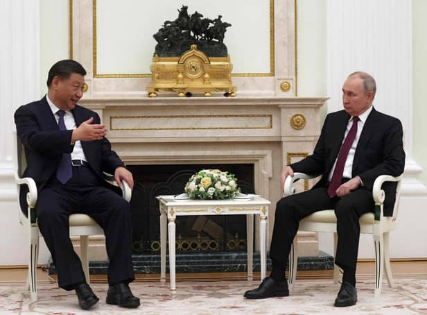 Russian President Vladimir Putin met with China's President Xi Jinping at the Kremlin in Moscow on Monday. (Picture: Sergei Karpuhkin/AFP via Getty Images)